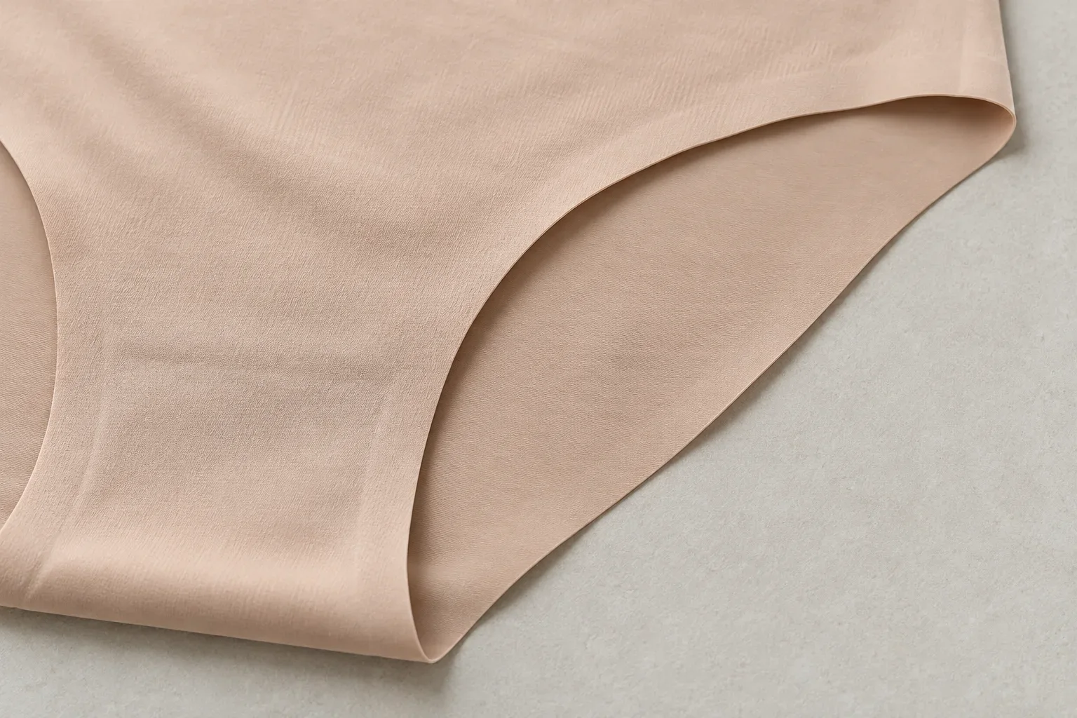 Illustration of a clean-cut edge on a nude seamless brief